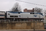 AMTK 75 leads train 80 to the station at Elm